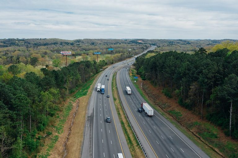 Roads with driving vehicles and trucks