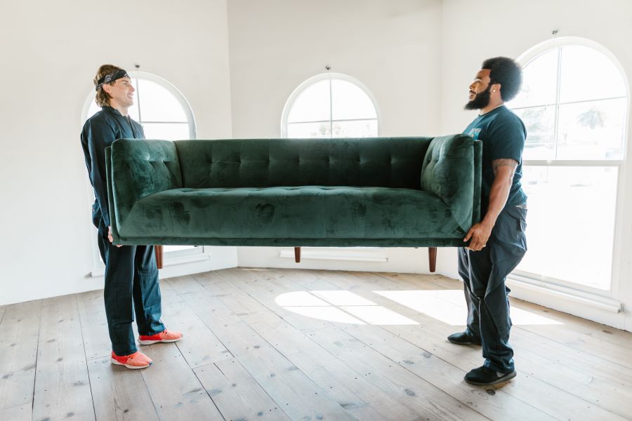 movers carrying a sofa