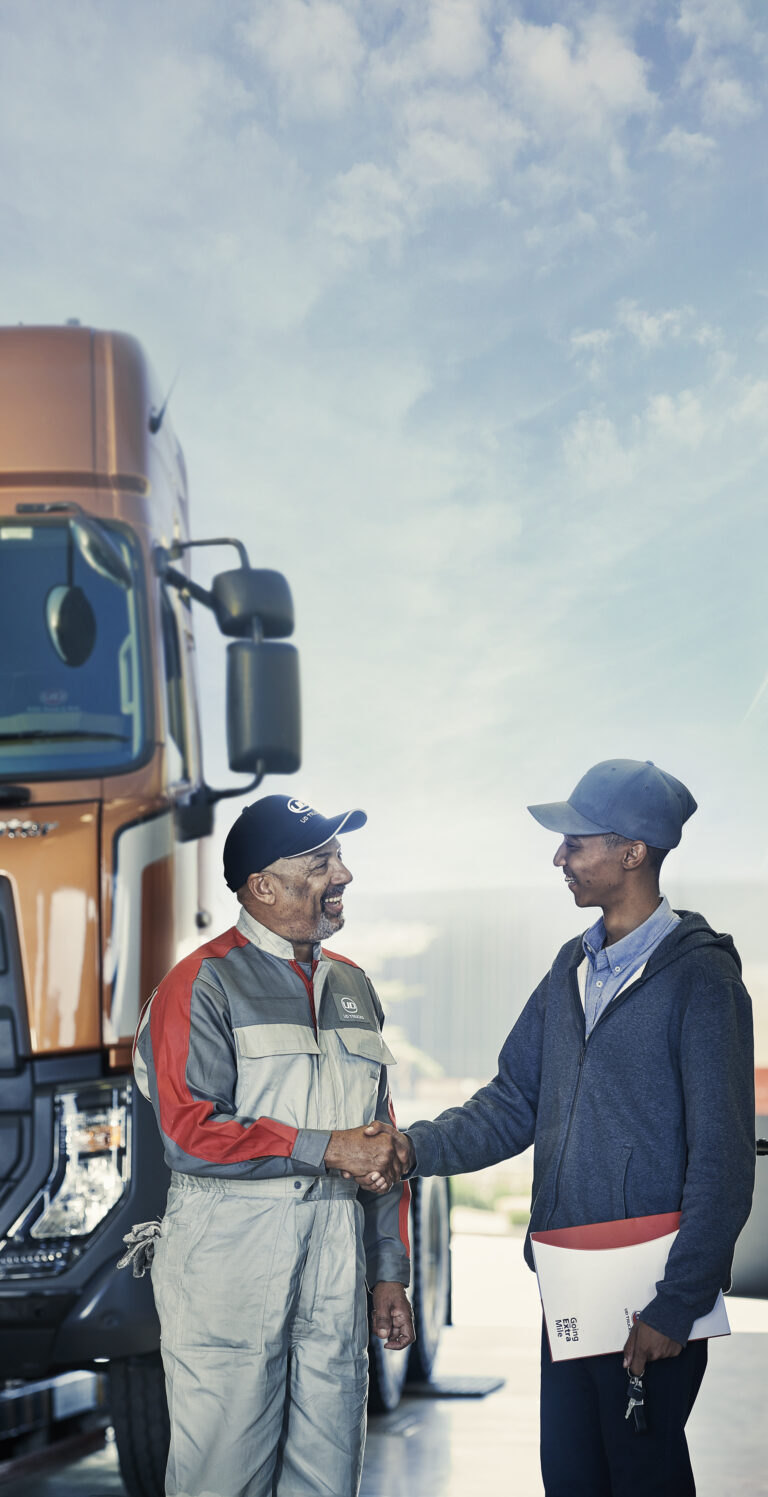 UD Truck mechanics shaking hands